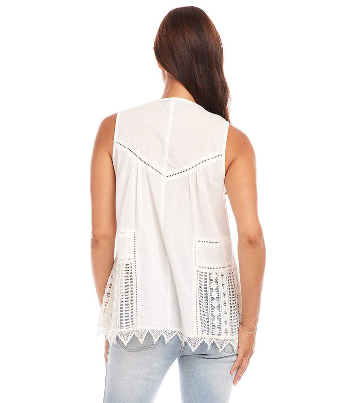 Back view of white lace trim sleeveless top with cut-out details and relaxed fit worn with light blue jeans