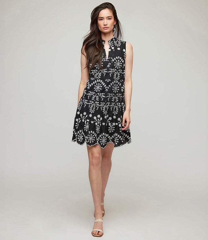 Petite size sleeveless black eyelet dress with A-line silhouette and split neck detail