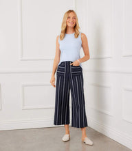 Light blue striped cropped wide-leg pants with front patch pockets and high-rise waist on navy fabric
