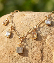 Locked In Light Charm Necklace with cubic zirconia pendants on 16K gold-over stainless steel chain