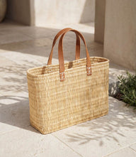Natural Straw Tote Bag handwoven from reeds with sisal handles and bohemian style