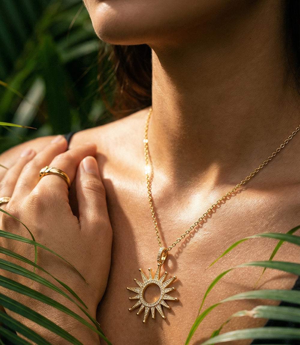 Gold plated Pavé Starburst Necklace with crystal pendant, 18-inch length, made in USA