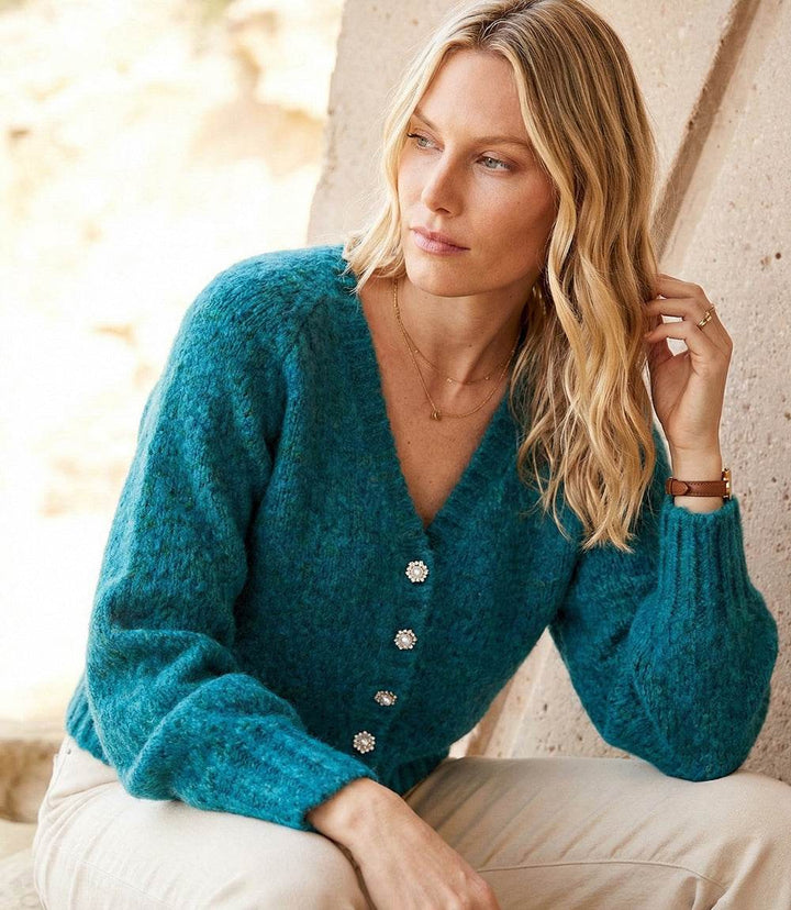 Pearl Button Cardigan sweater with ribbed V-neck, raglan sleeves, and pearl-inspired buttons in a cozy wool-blend knit