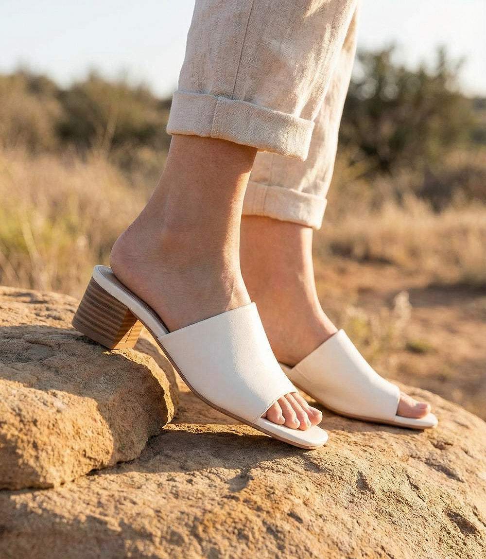 Elegant Pepper Mid Heel Sandals with square toe, 2-inch heel, leather and synthetic materials, slip-on design, imported by Seychelles