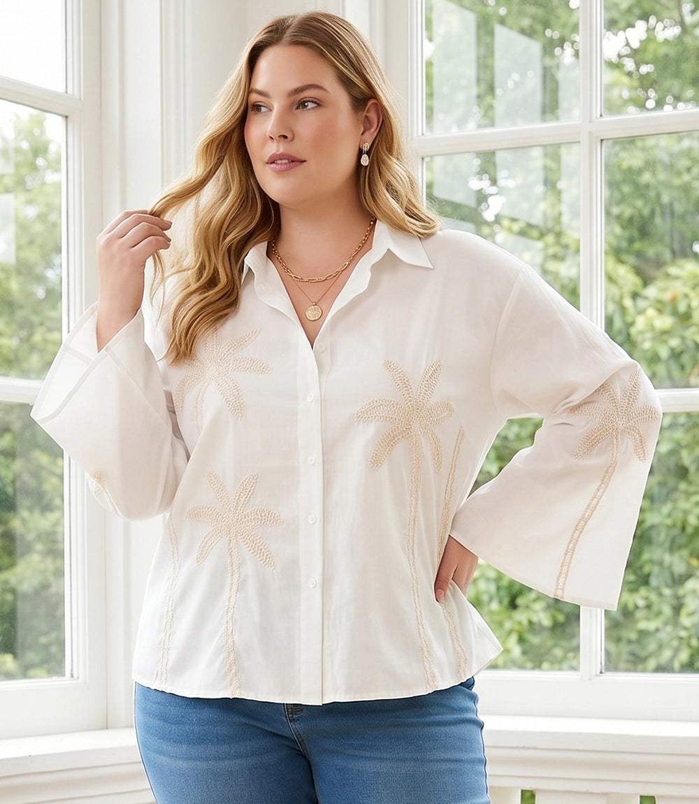Plus size cream bell sleeve shirt with embroidered palm trees and button front closure
