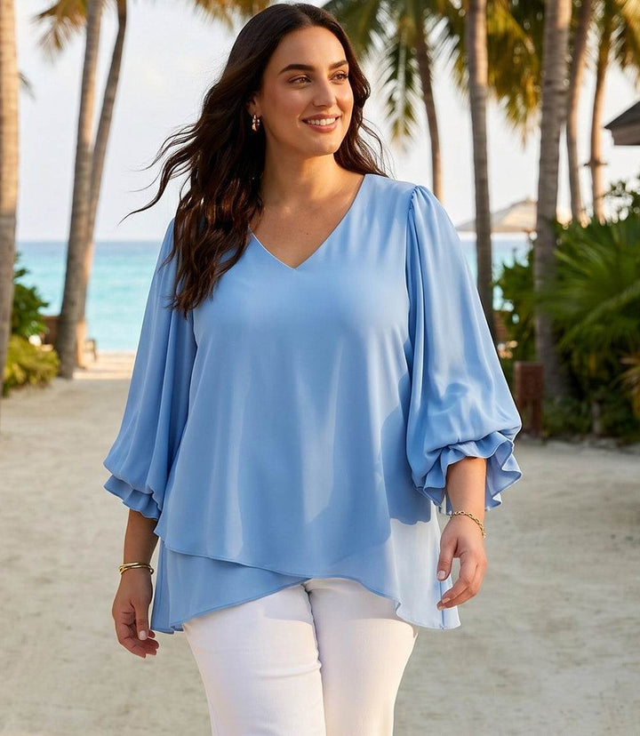 Plus size layered sleeve asymmetric top in silky crepe with V-neck and fluid drape