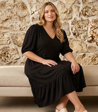 Plus size puff sleeve tiered dress in soft rayon spandex jersey with V-neck and flowy skirt