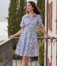 Light blue paisley puff sleeve tiered shirtdress with collared neck and button front closure