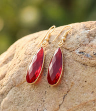 Ruby quartz earrings with faceted teardrop stones in gold-plated brass, lightweight and elegant design