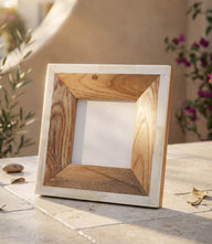 Small wood picture frame handcrafted from teakwood with bone accents, natural wood tone, and easel stand for tabletop display.