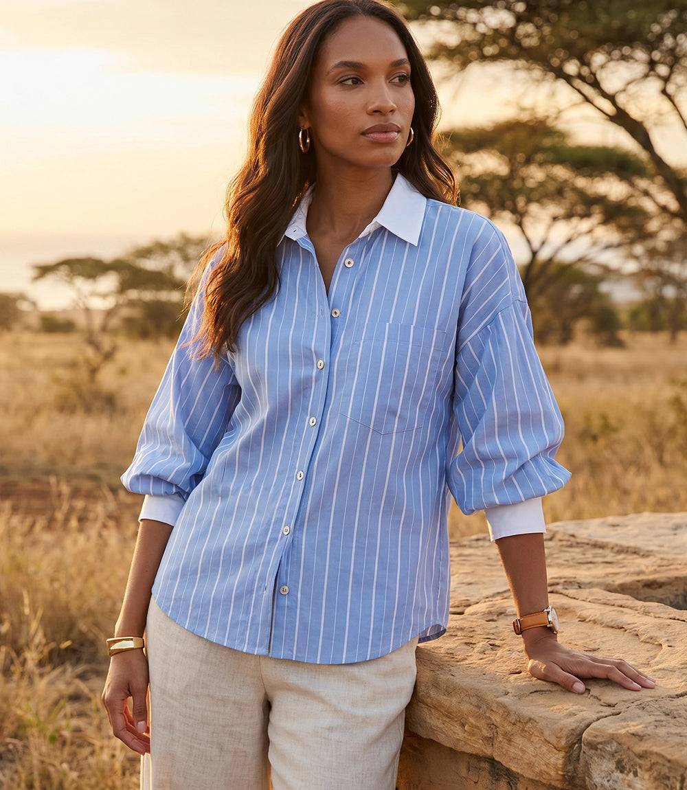 Women's stripe lantern sleeve button-up shirt with mixed thick and thin stripes, chest pocket, and extended cuffs