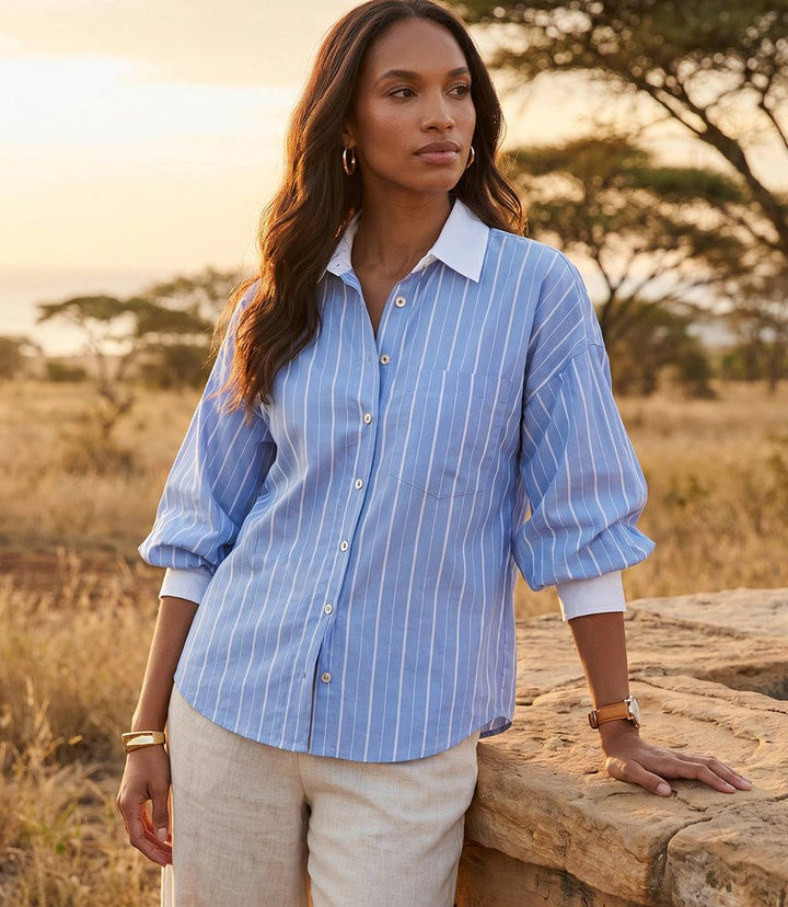 Women's stripe lantern sleeve button-up shirt with mixed thick and thin stripes, chest pocket, and extended cuffs