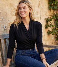 Travel jersey drape front crossover top with side pleats and drop shoulder sleeves