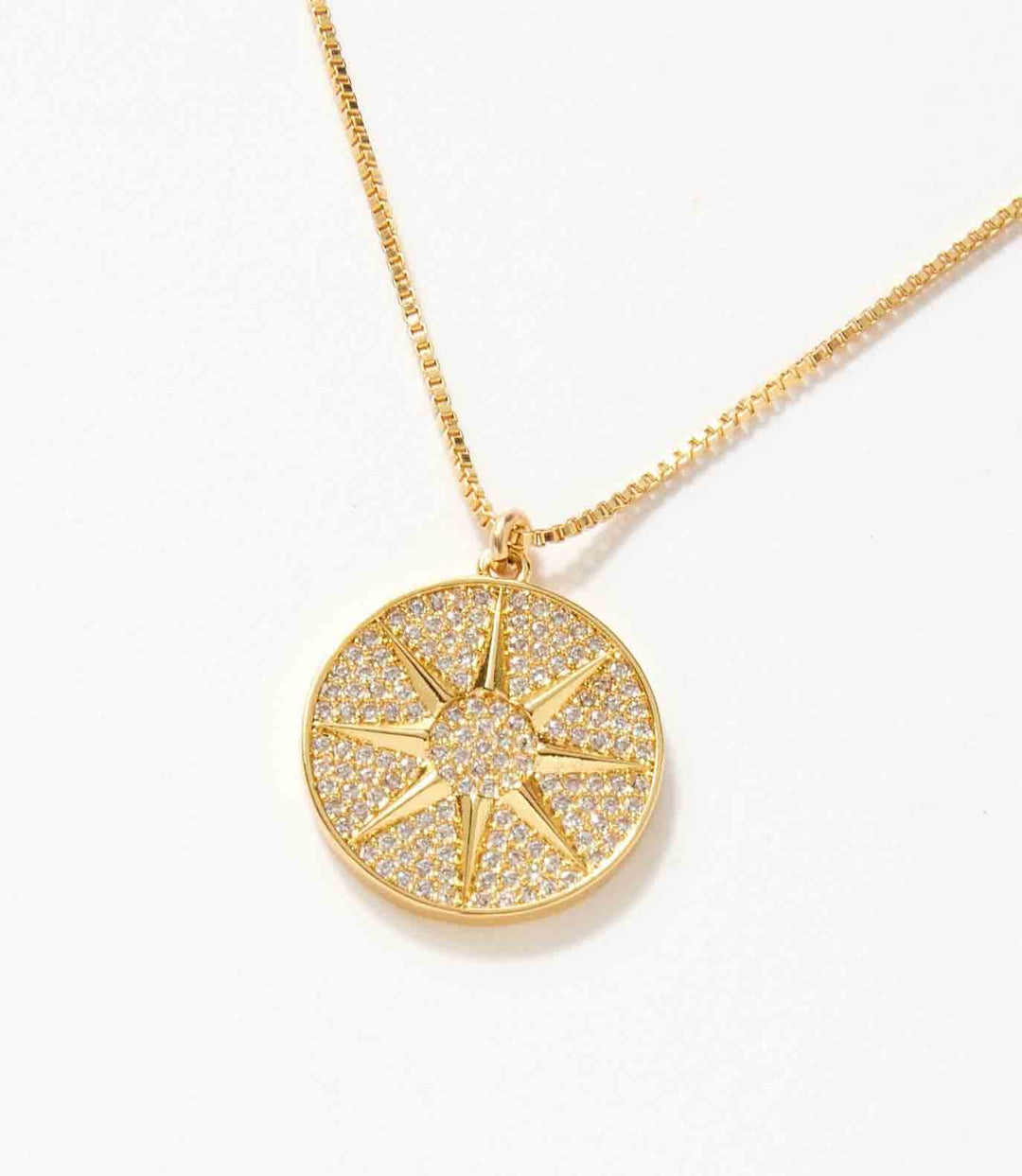 18k gold pavé sun dial necklace with micro pave cubic zirconia stones and 16-inch chain