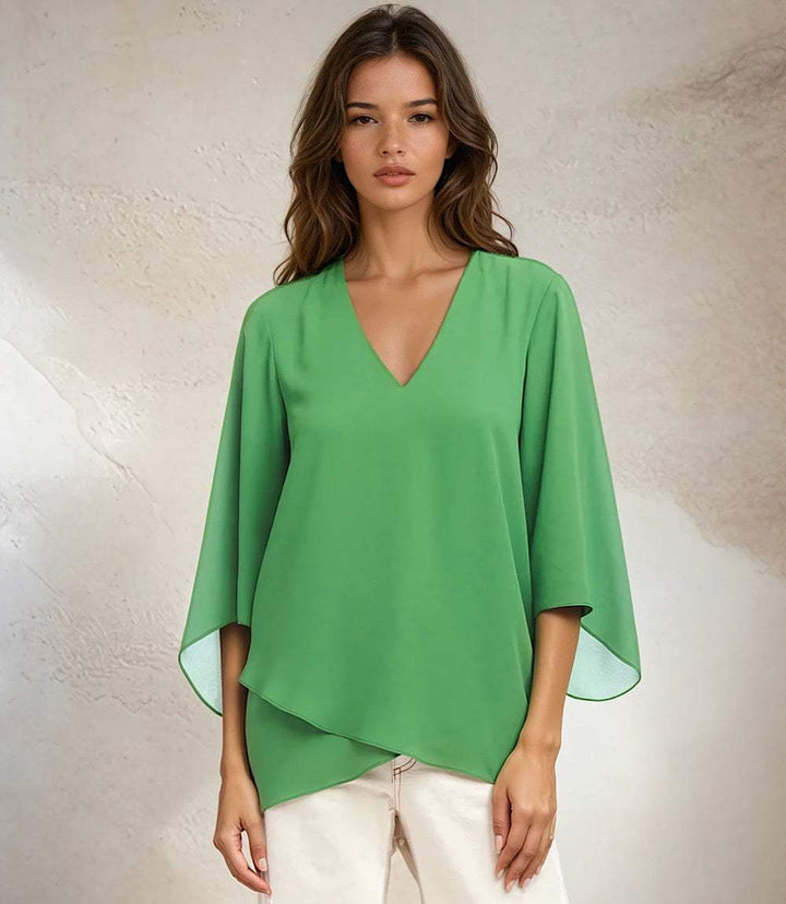 Green Bracelet Sleeve Asymmetric Top with V-neck, flare sleeves, and layered hem on model
