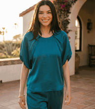 Women's puff sleeve satin top with raglan sleeves and back zipper closure