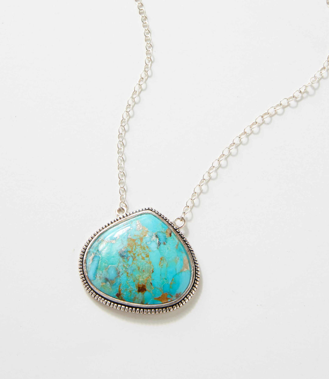 Corinth Blue Turquoise pendant necklace with sterling silver chain and textured border