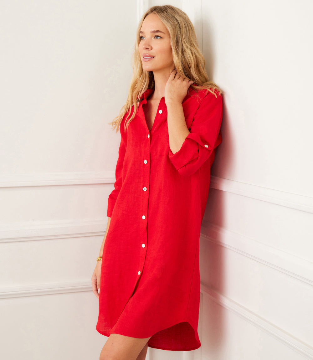 Woman wearing red roll tab linen shirtdress with front buttons and chest pocket