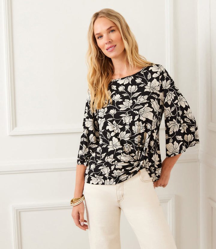 Petite size flare sleeve top with cream floral print on black background, boat neck and twist hem.