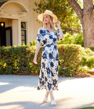 Blue navy floral satin bias cut skirt with midi-length silhouette and feather flower print