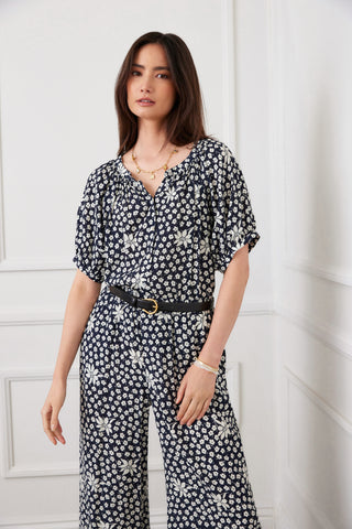 woman wearing matching blue and white floral pattern top and pant
