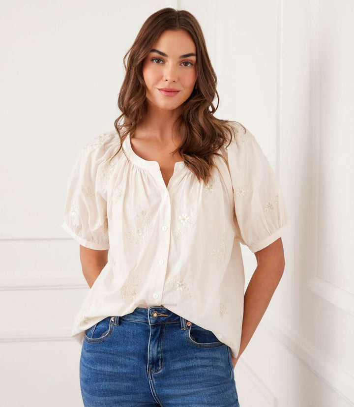 Short sleeve embroidered peasant top in breathable cotton with front buttons and relaxed fit