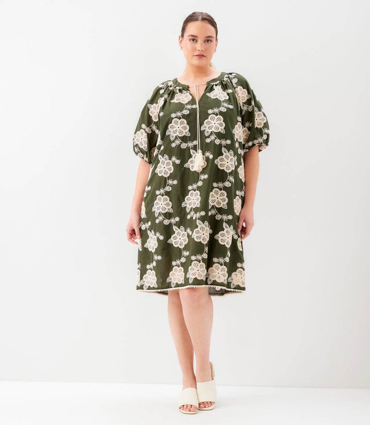 Plus size puff sleeve tassel dress in breathable cotton with tie neck and side pockets