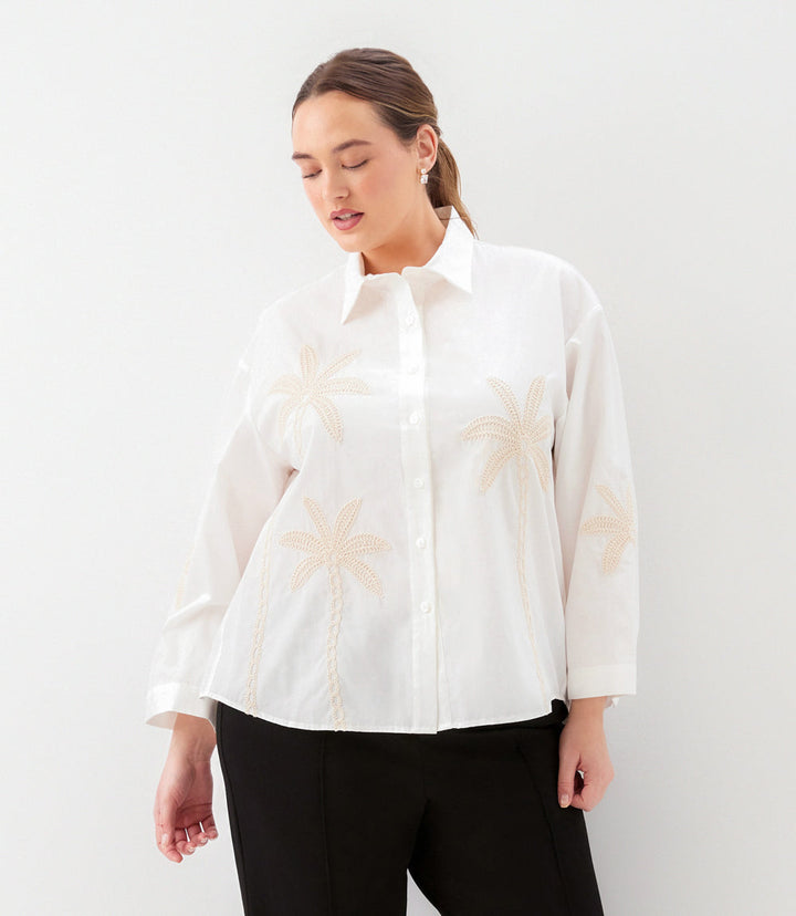 Plus size bell sleeve shirt with embroidered palm trees and button-front closure in lightweight cotton