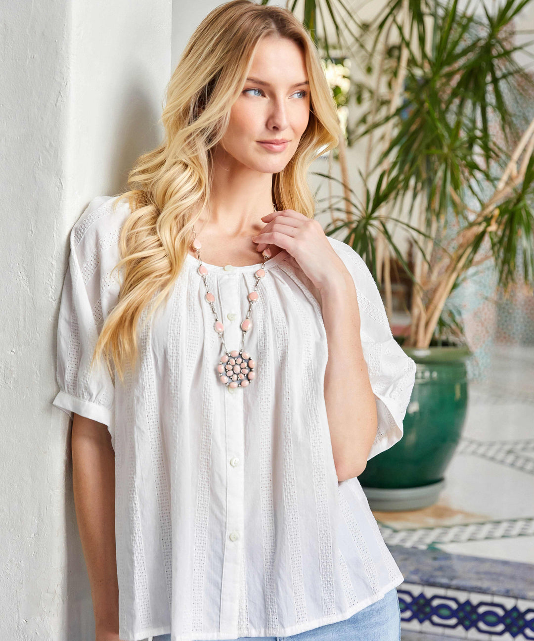 Petite size short sleeve embroidered peasant top with front buttons, scoop neck, and puff sleeves in white cotton.