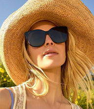 DIFF Gia Square Sunglasses with bold black hand-cut acetate frame and oversized square black lenses.