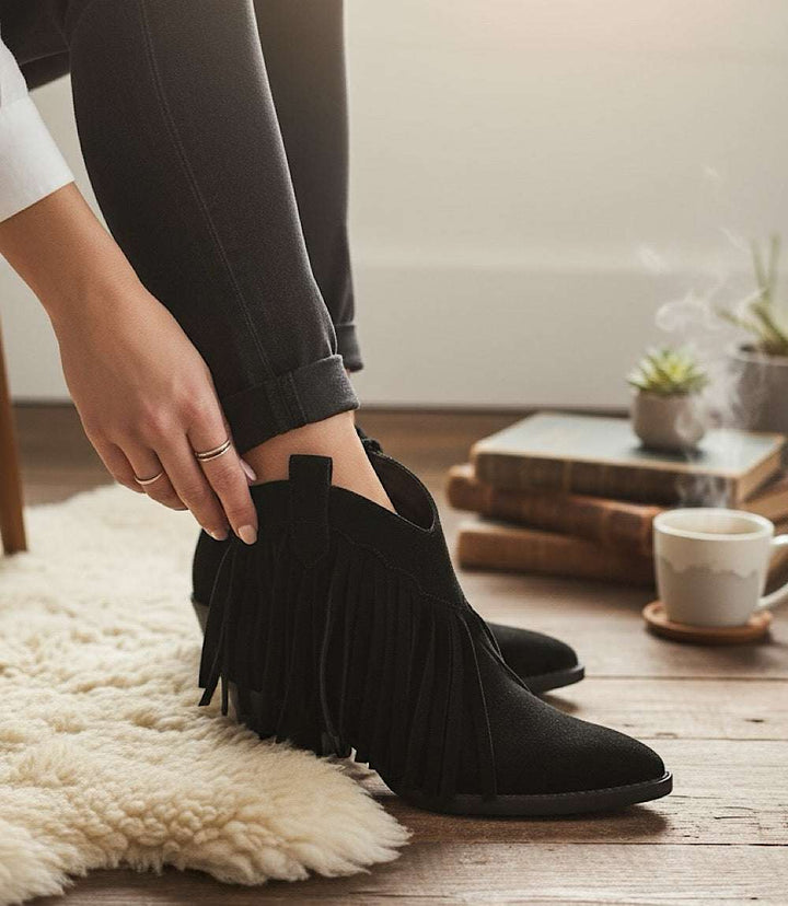 Seychelles Easy Come Easy Go black suede ankle booties with fringe and pointed toe.