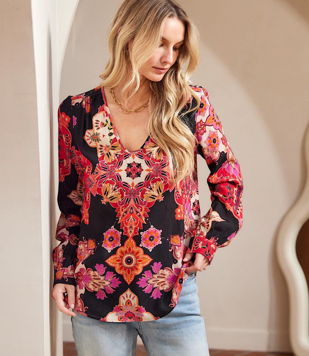Petite size long sleeve blouse with u-neckline and red magenta floral medallion print on black background