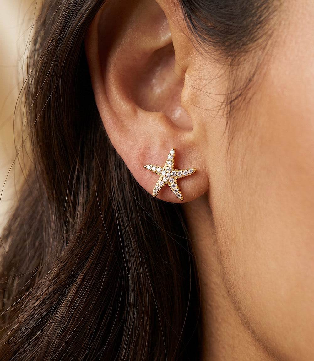 Pavé starfish stud earrings in gold with sparkling cubic zirconia beach-inspired design