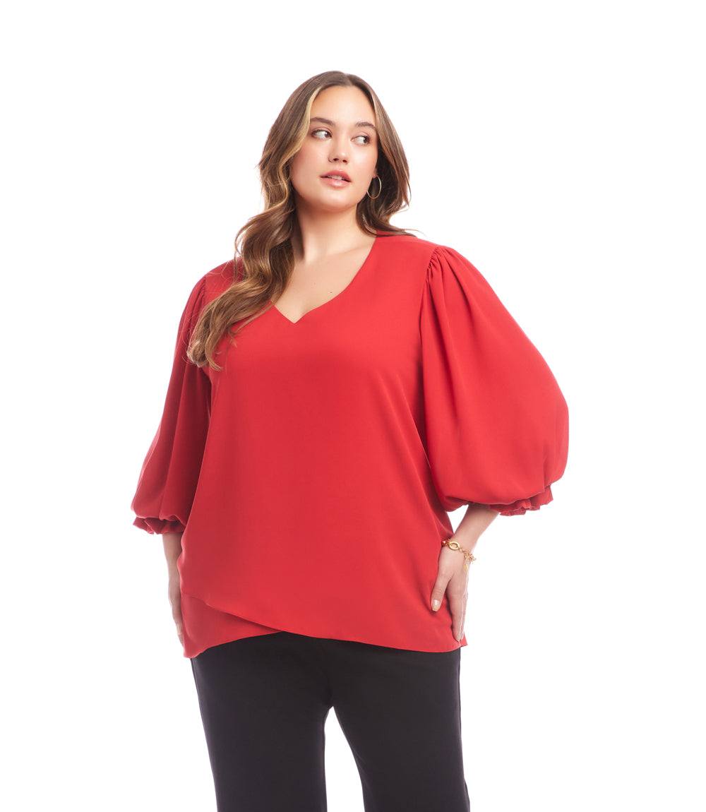 Plus size red V-neck top with bishop sleeves and asymmetrical layered hem