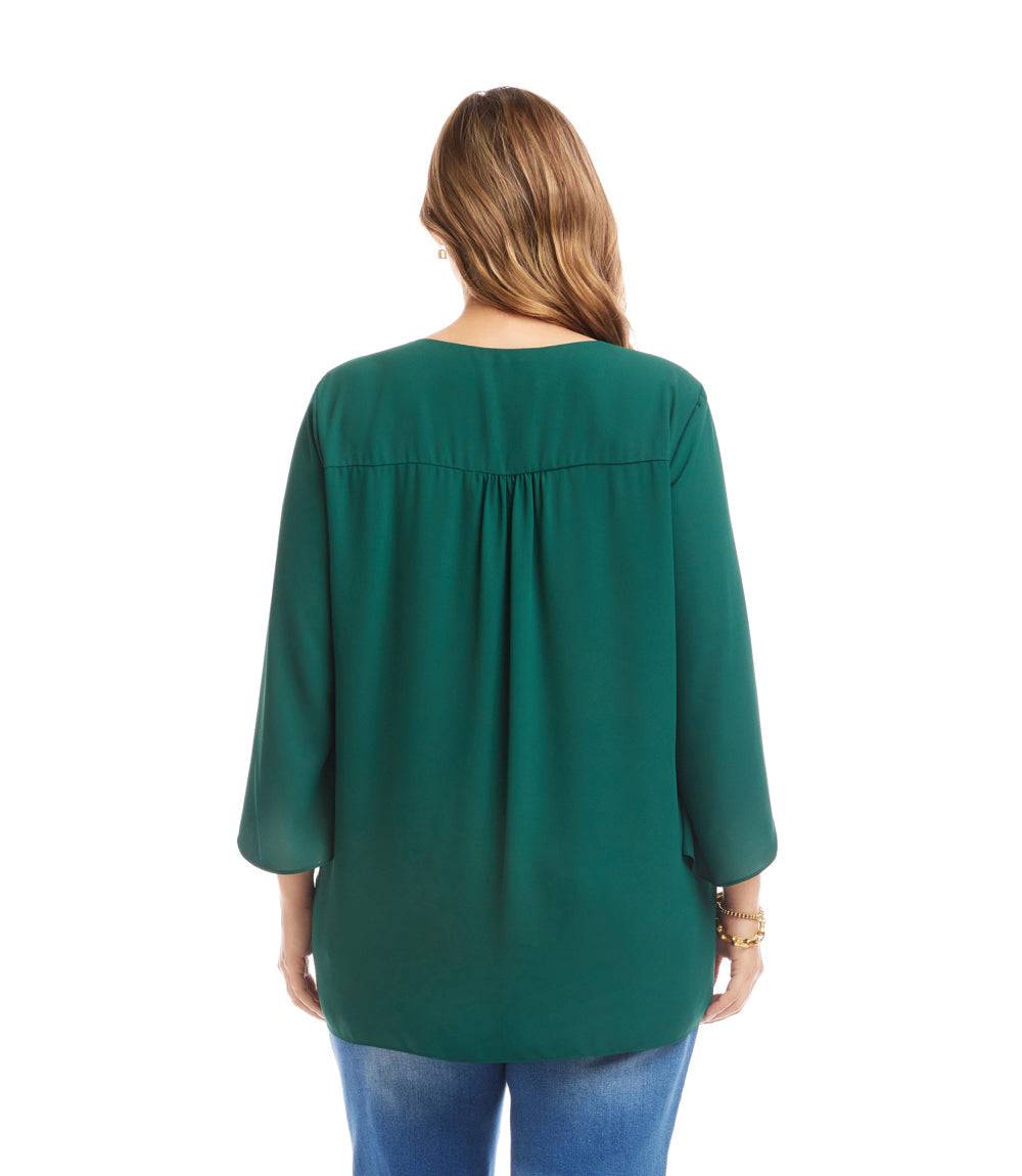 Plus size green bracelet sleeve asymmetric top with flowy layered hem shown from back