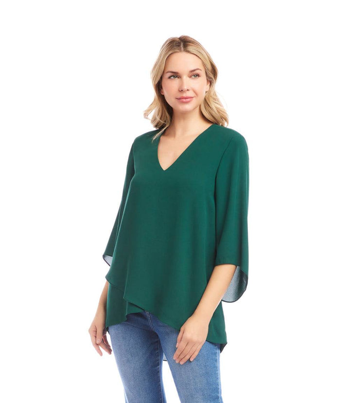 Green bracelet sleeve asymmetric top with V-neck and layered hem on model