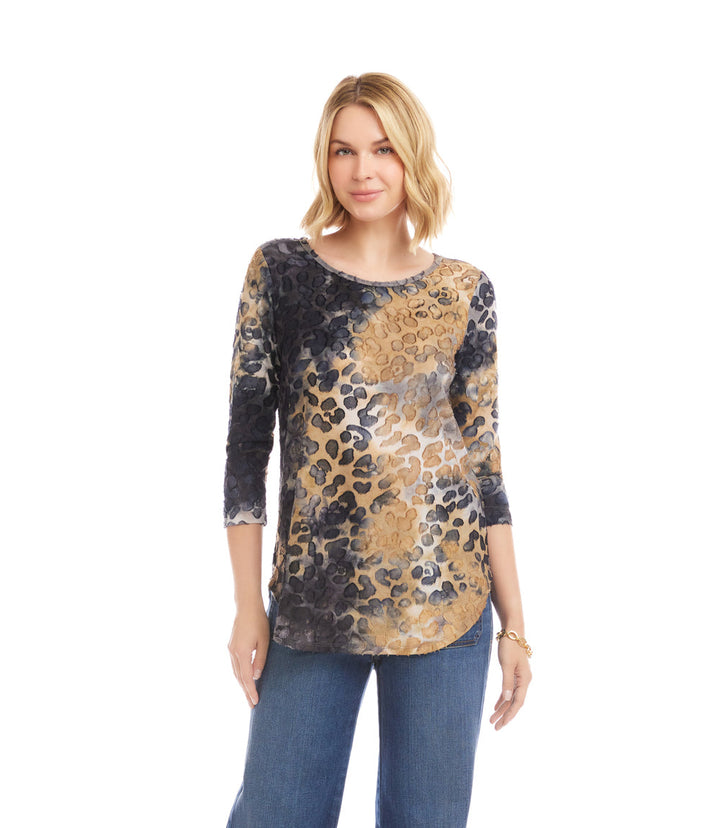 Woman wearing 3/4 sleeve burnout shirttail top in brown leopard tie-dye with scoop neck and relaxed fit