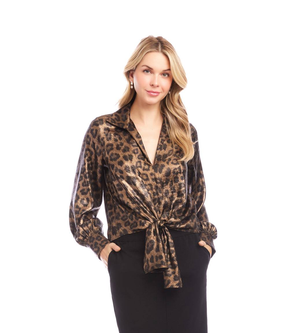 Woman wearing a shimmer leopard print long sleeve tie-front top with a plunging V-neckline and buttoned cuffs