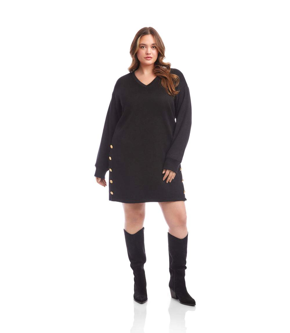 Plus size long sleeve black V-neck sweater dress with gold button details and straight silhouette