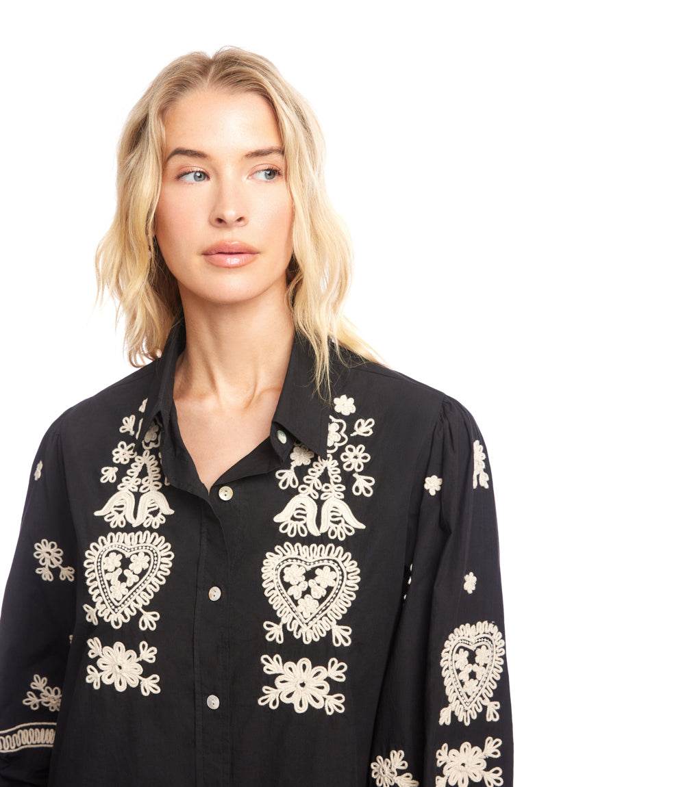 Black blouson sleeve shirtdress with intricate cream rope-stitch embroidery and shell buttons
