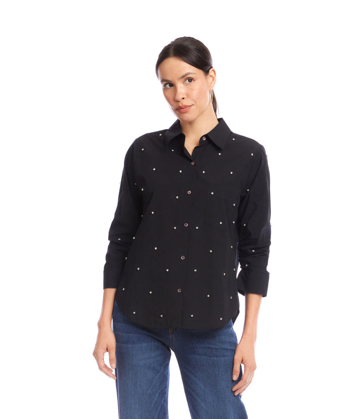 woman wearing black embellished ruched sleeve shirt with button front and collar