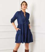 Petite size roll tab tiered shirtdress with button front, chest pocket, mandarin collar, and flared tiered skirt