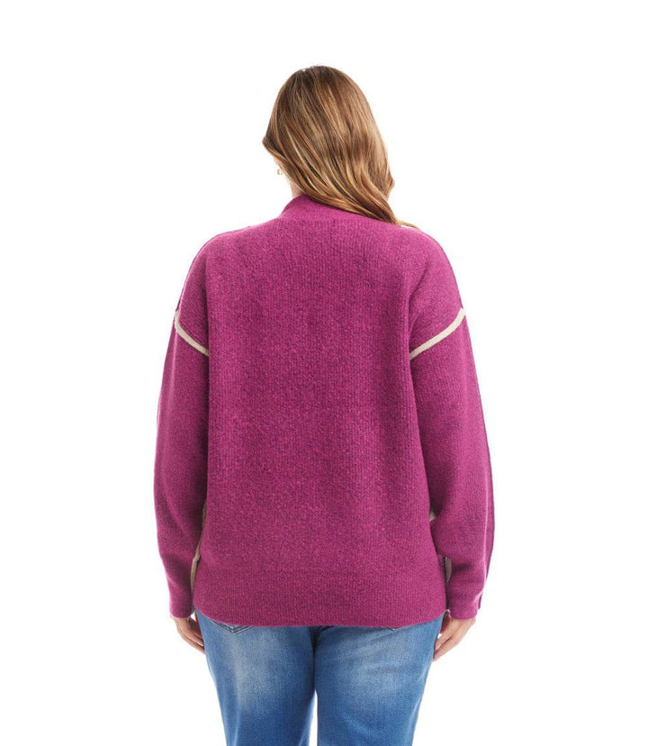 Plus size colorblock mock neck sweater with drop shoulder sleeves and bold paneling, shown from back
