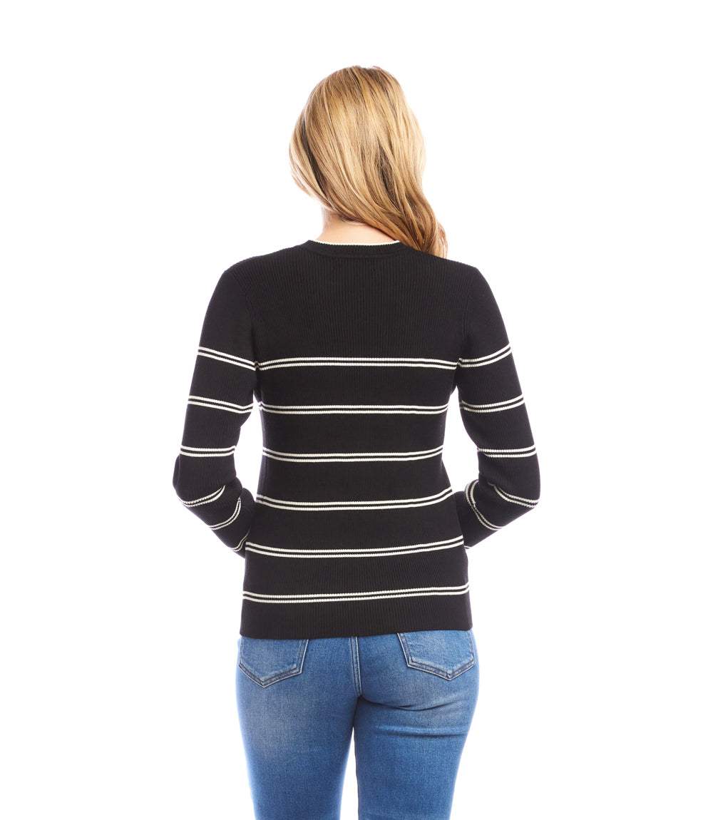 Woman wearing a slim-fit black double stripe ribbed sweater with cream horizontal stripes, paired with blue jeans, viewed from the back.