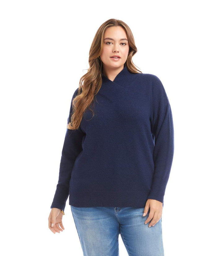 Plus size navy shawl collar sweater with long drop sleeves and ribbed cuffs modeled with jeans