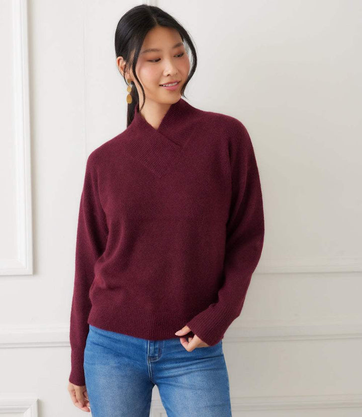 Petite size shawl collar sweater in burgundy with drop shoulders and ribbed trim, styled with jeans.