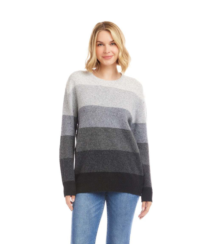 Woman wearing multi stripe crewneck sweater with tonal grey stripes and drop shoulder design