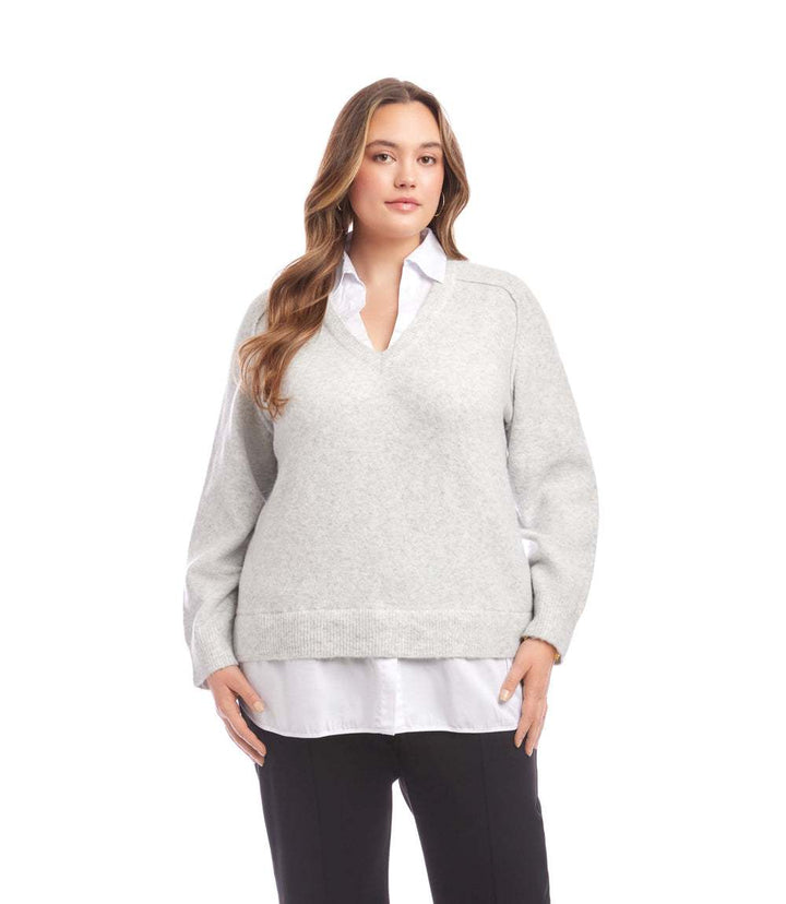 Plus size layered sweater with V-neck, shirt collar detail, raglan sleeves, and faux-layered shirttail hem in light gray