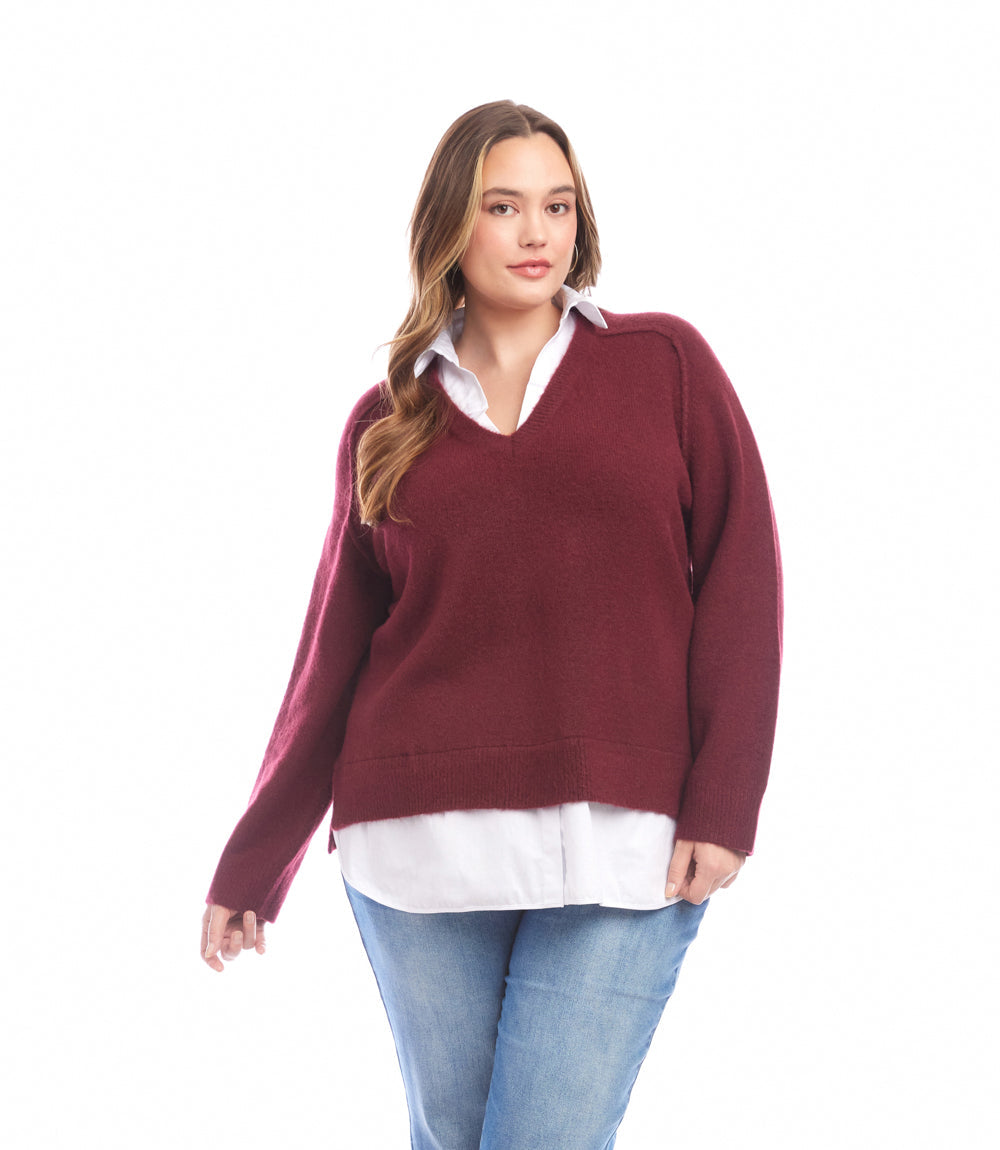 Plus size layered sweater with V-neck, shirt collar, raglan sleeves, and faux-layered shirttail hem in burgundy color