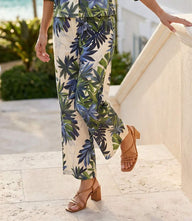 Petite size drawstring ankle pants with green and blue island palms print, wide-leg silhouette, and side pockets